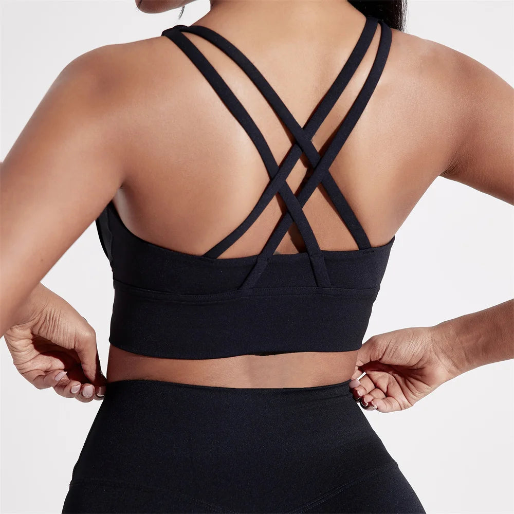 Sujetador deportivo de Color sólido con espalda cruzada para mujer, Top ajustado de alta resistencia, ropa interior de entrenamiento integral para gimnasio y Yoga con almohadilla para el pecho