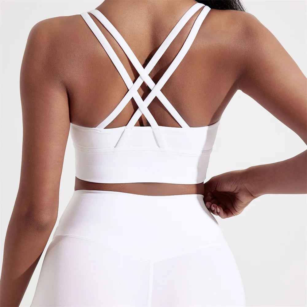 Sujetador deportivo de Color sólido con espalda cruzada para mujer, Top ajustado de alta resistencia, ropa interior de entrenamiento integral para gimnasio y Yoga con almohadilla para el pecho