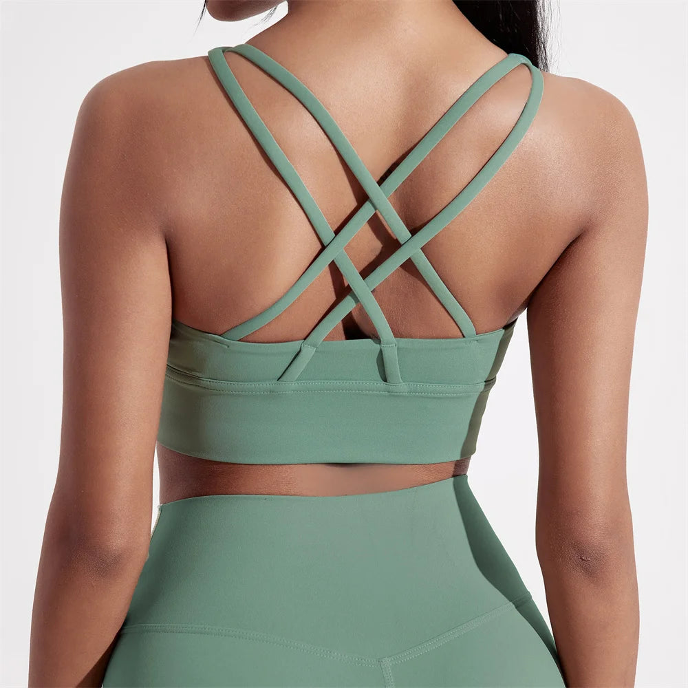 Sujetador deportivo de Color sólido con espalda cruzada para mujer, Top ajustado de alta resistencia, ropa interior de entrenamiento integral para gimnasio y Yoga con almohadilla para el pecho