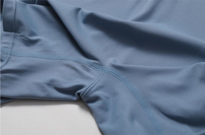 Traje de yoga de una pieza desnudo europeo y americano con cuello alto, media cremallera, mono deportivo de manga corta, ajustado